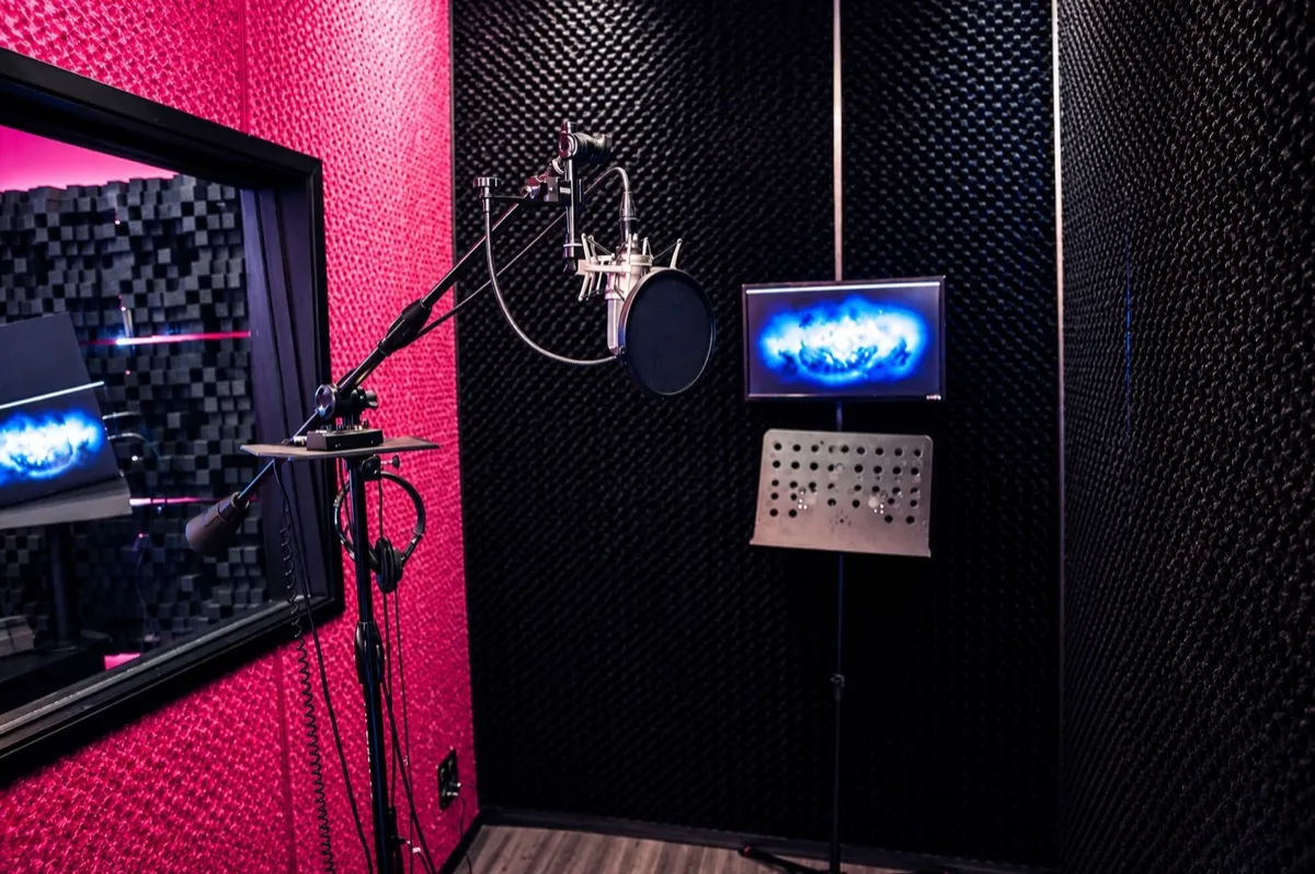ZOOM I vocal booth in Los Angeles with a Neumann U87 on a boom stand, a script stand and a screen